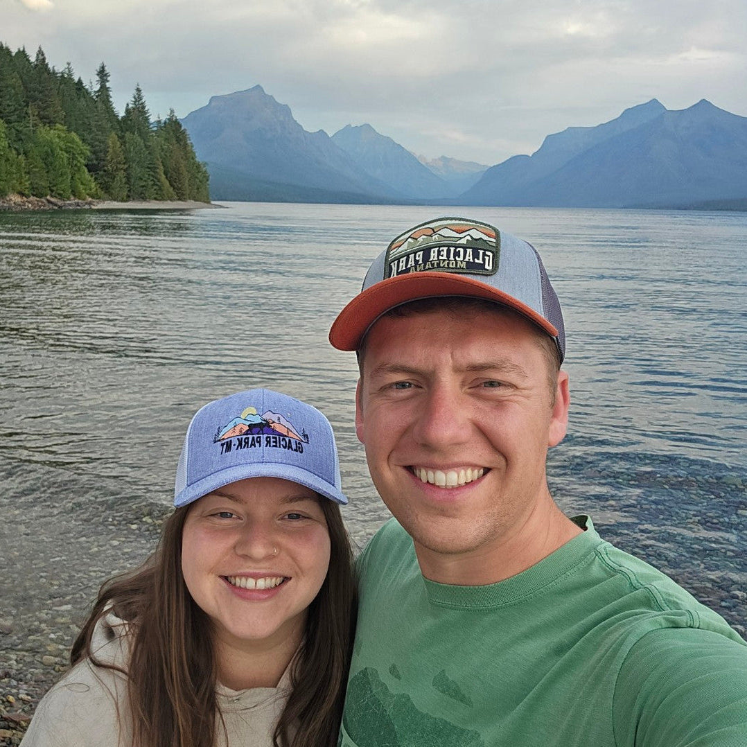 husband and wife vital roots wellness brand owners and lake with mountains